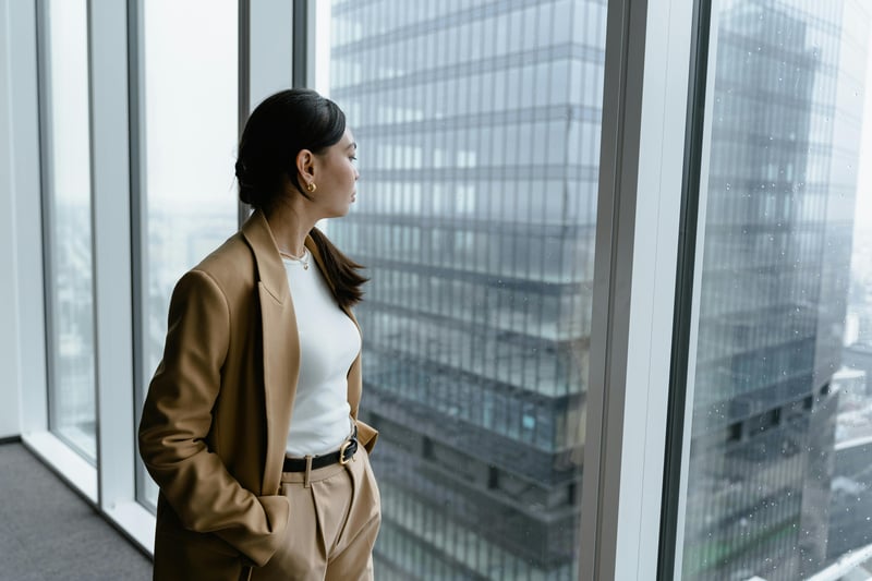 woman looking out window